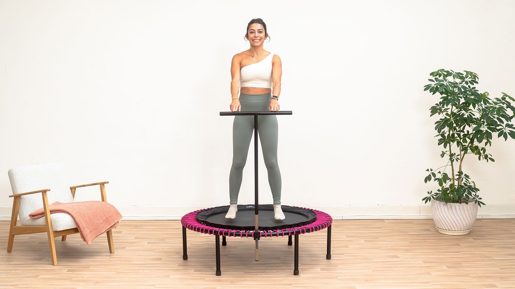 Woman bounces on the bellicon minitrampoline and activates her vagus nerve..